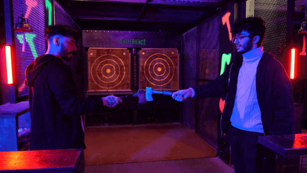 Person throwing an axe at a target at Axeperience London Tower Hill